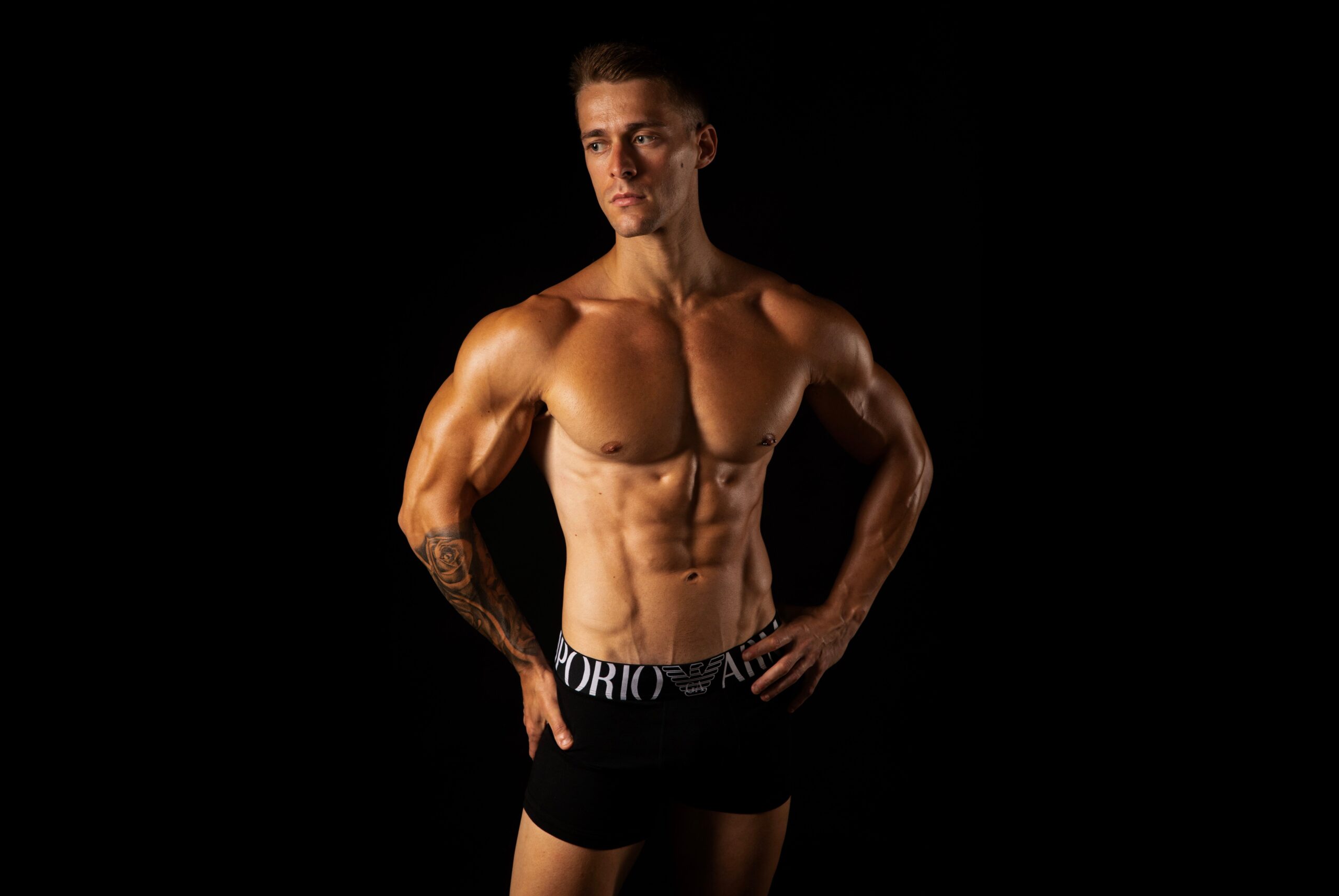 Strength training for toned body shown through a lean, defined physique during a home workout session