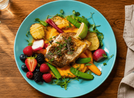 7 day anti-inflammatory diet meal plan featuring grilled salmon, mixed berries, and leafy greens on a plate