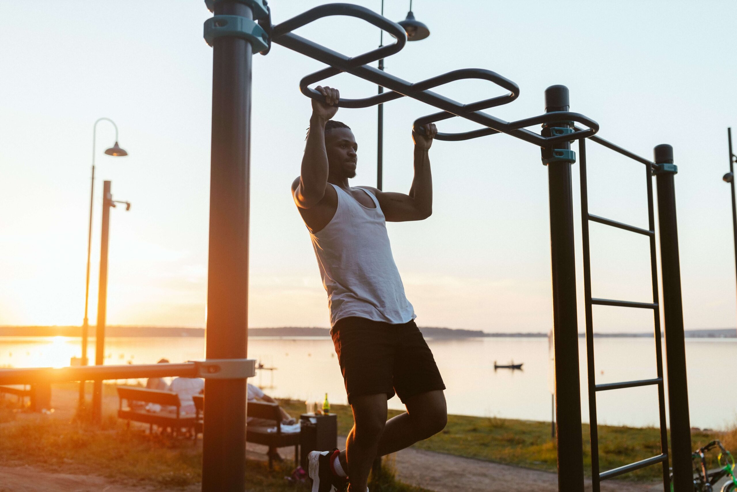 Man performing a pull-up, showing back and bicep engagement