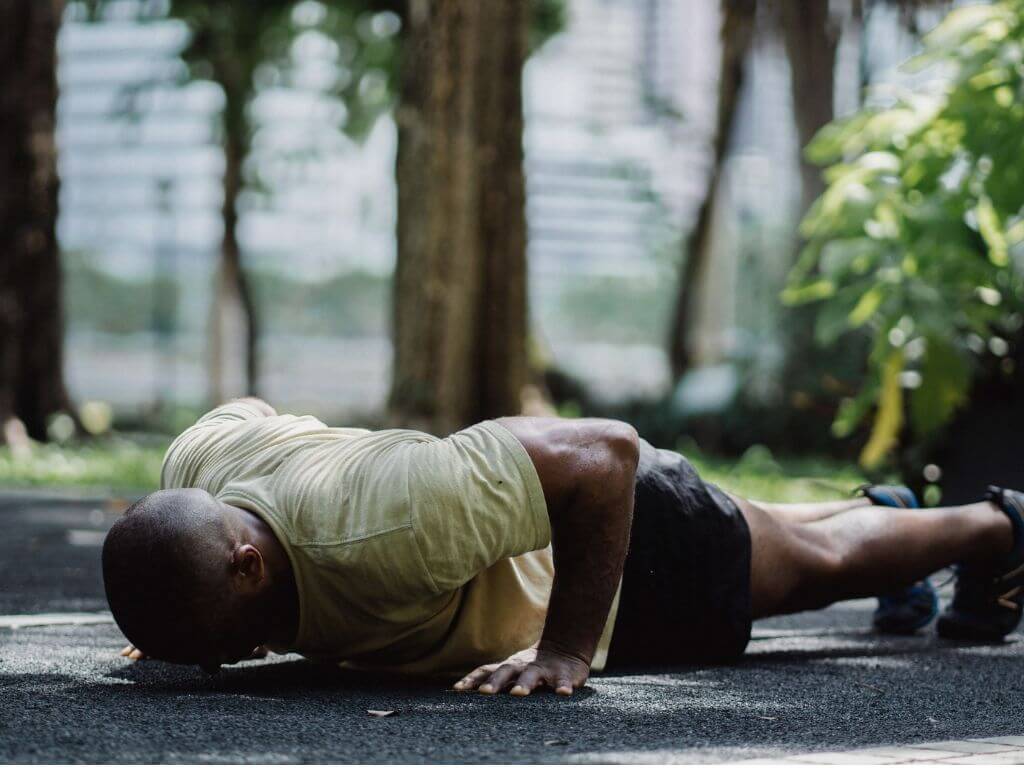 Person performing a hand release push up, a core exercise of what is military calisthenics