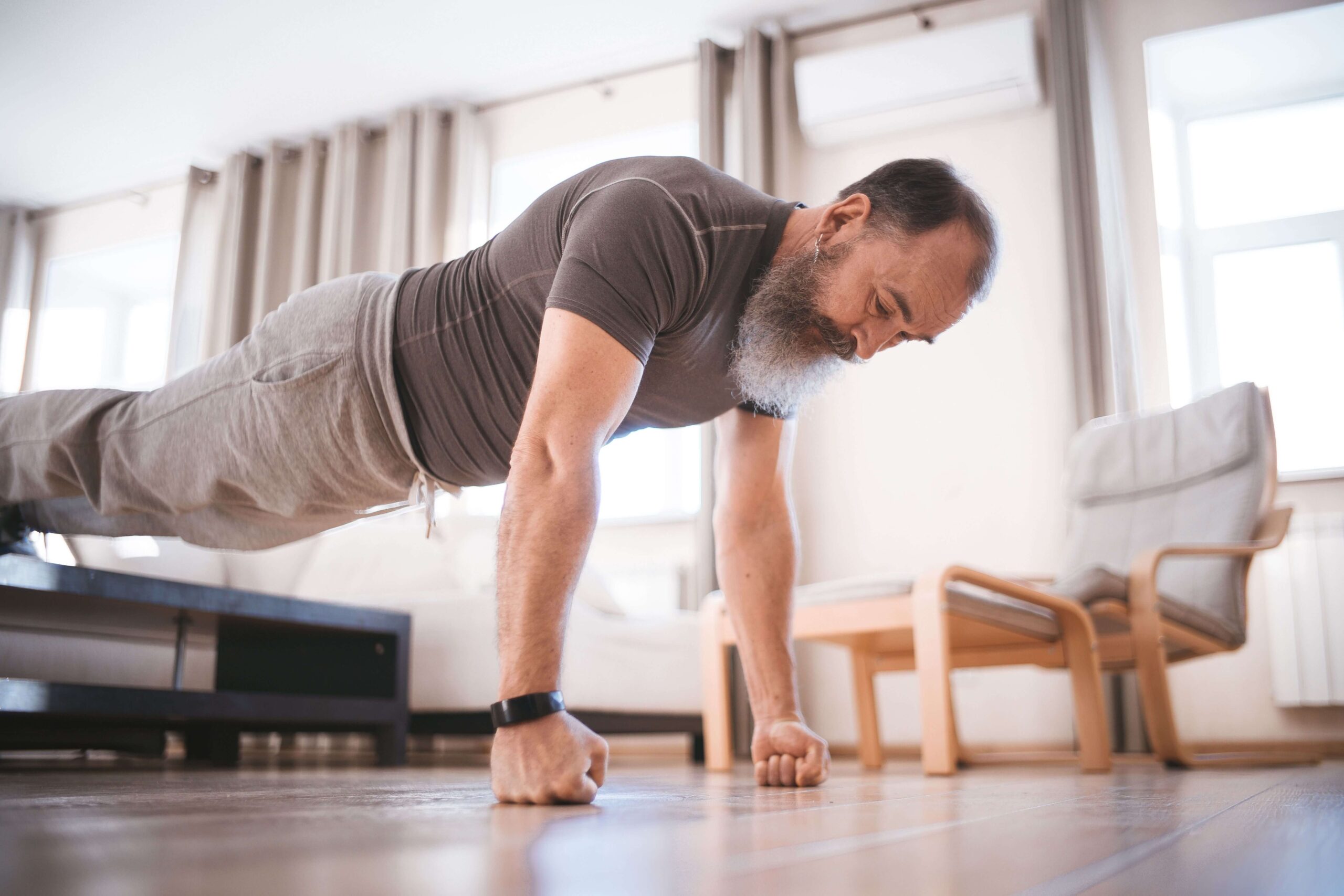 Man performing a push up as an example of an isotonic calisthenics exercise