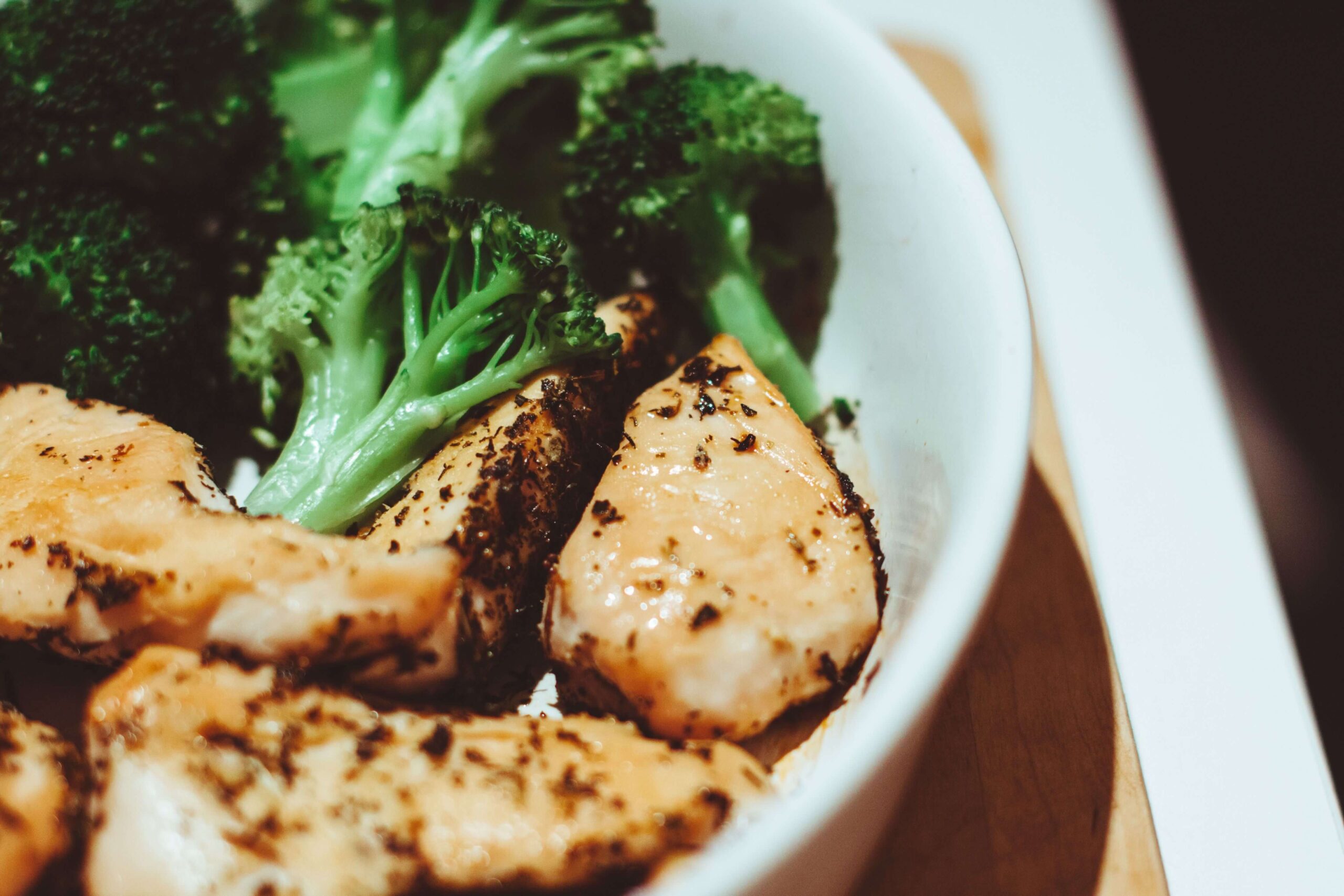 Protein-rich chicken and vegetable bowl supporting muscle recovery after a pilates reformer workout